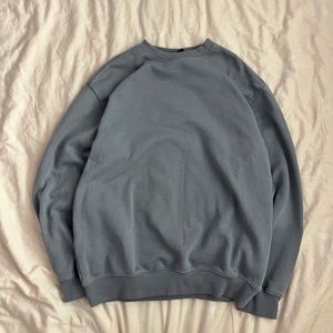 blue-grey crewneck sweatshirt